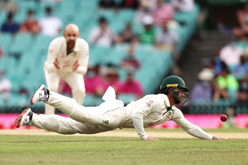 Australia fielder Matthew Wade unsuccessfully attempts to catch out Ajinkya Rahane. Getty