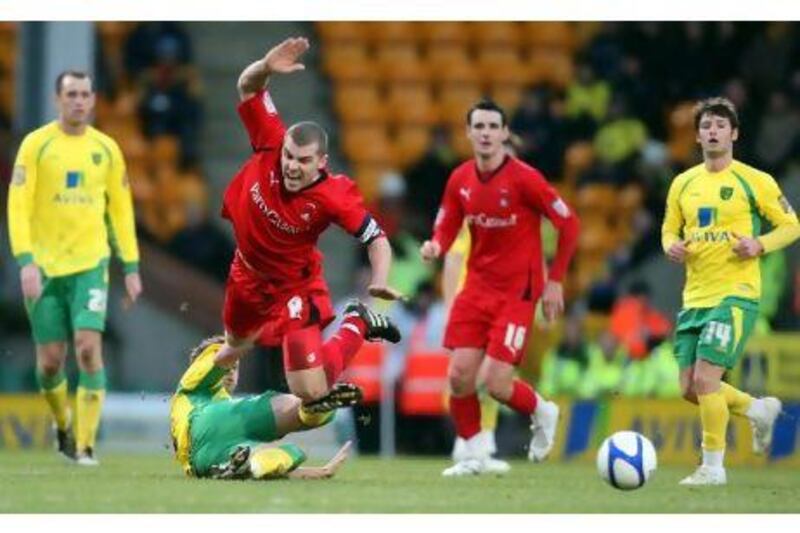 Stephen Dawson is challenged by Norwich City's David Fox during an earlier FA Cup round. The midfielder estimates as many as 70 of his family and friends will be at Brisbane Road today to see his side face Arsenal. Chris Radburn / PA