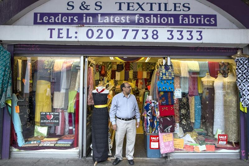 Mohammed Shafiq stands outside his textiles shop. Mr Shafiq has been the proprietor of the business at Brixton arches for 10 years. Dan Kitwood / Getty