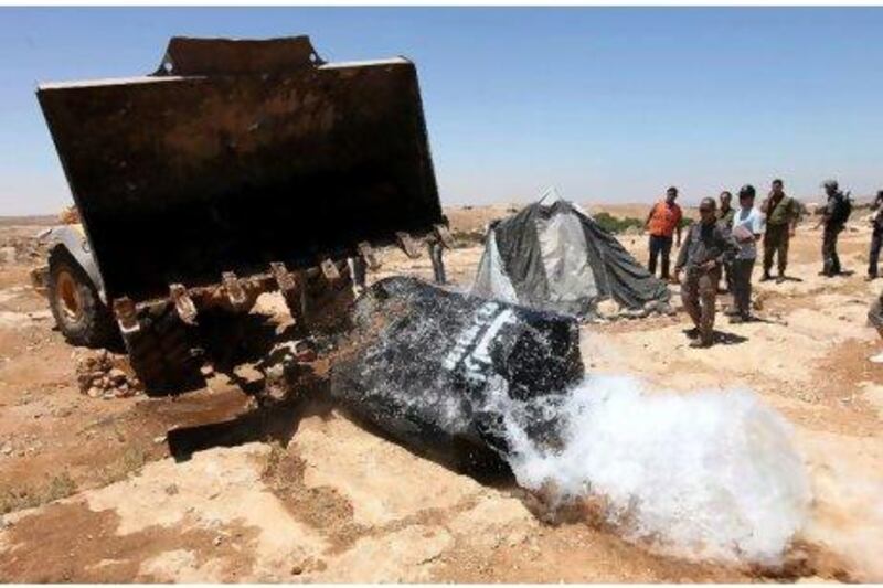 Israeli authorities destroy a water reservoir used by Palestinian farmers in Hebron as they aim to curb the theft of water from the Israeli settlement of Sosia. Israel claims 90 per cent of the West Bank's water resources. EPA / Abed Al Hashlamoun