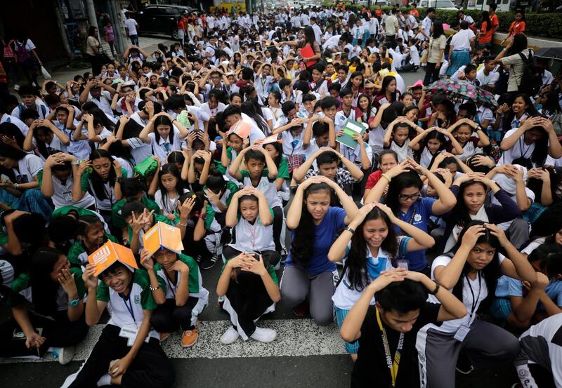 Filipino students participate in an earthquake drill in Paranaque, Manila. EPA