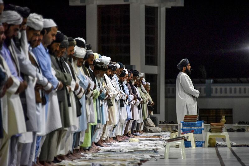 Muslims offer Taraweeh evening prayers on the first day of the Muslim holy month of Ramadan at a mosque in Kandahar city.  AFP