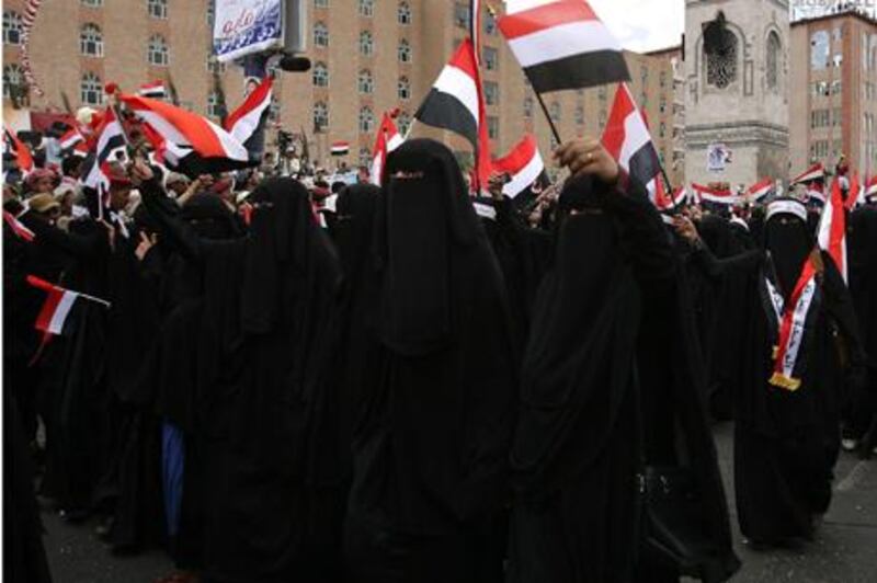 Yemeni women march in Sanaa on May 22, 2011 during a parade by anti-government protesters marking the anniversary of Yemen's reunification on the sidelines of a daily demonstration calling for the ouster of President Ali Abdullah Saleh. AFP PHOTO/ MOHAMMED HUWAIS
 *** Local Caption ***  054935-01-08.jpg