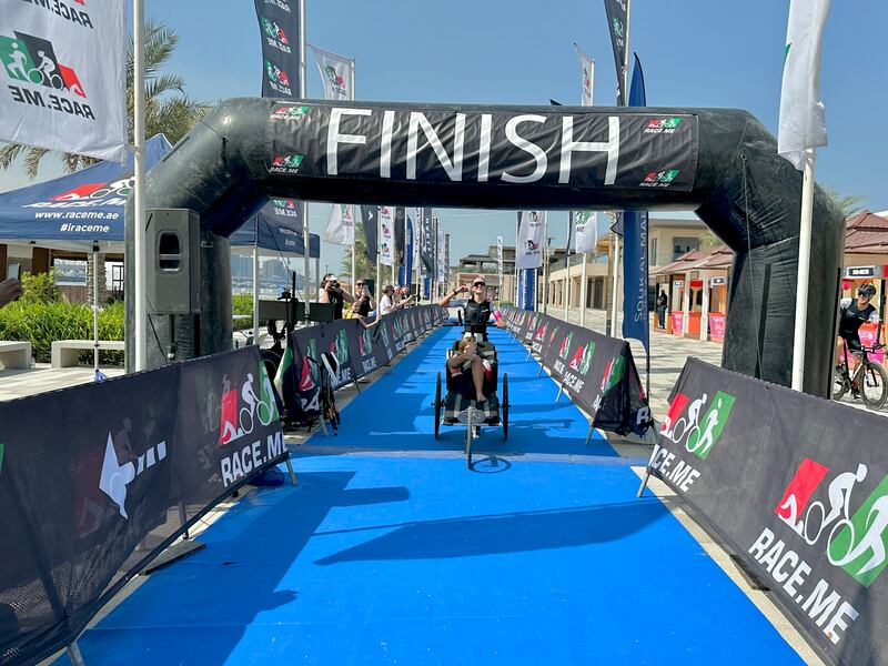 Tia Watson crossing the finish line with her brother to break a new world record. Photo: Team Angel Wolf