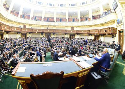 epa07369265 A picture taken with a fish eye lens shows speaker of the Egyptian House of Representatives Ali Abdel Aal (R) presiding over a parliament session to discuss and vote on proposed constitutional amendments, in Cairo, Egypt, 14 February 2019. According to reports, the Egyptian Parliament on 14 February was due to vote on proposed amendments to articles of Egypt's 2014 constitution. The major proposed amendment is a transitional article that allows current Egyptian President Abdel Fattah al-Sisi to run for two more terms of six years each, as well as adding a Vice President position and bringing back the Senate that was cancelled in 2014.  EPA/KHALED MASHAAL