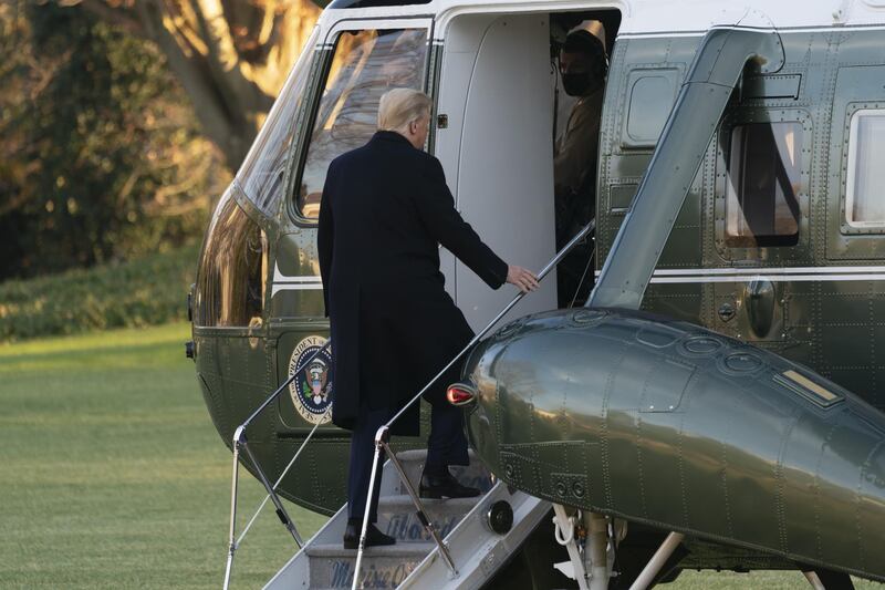 U.S. President Donald Trump boards Marine One on the South Lawn of the White House in Washington, D.C., U.S., on Wednesday, Dec. 23, 2020. Trump's surprise attack Tuesday on Congress's historic coronavirus relief package left aid for millions of Americans hanging in the balance as the pandemic continues to batter the nation. Photographer: Chris Kleponis/Polaris/Bloomberg