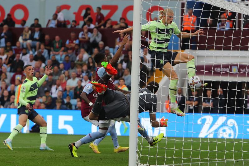 Manchester City striker Erling Haaland scores the opening goal in the 1-1 draw with Aston Villa at Villa Park on September 3, 2022. AFP