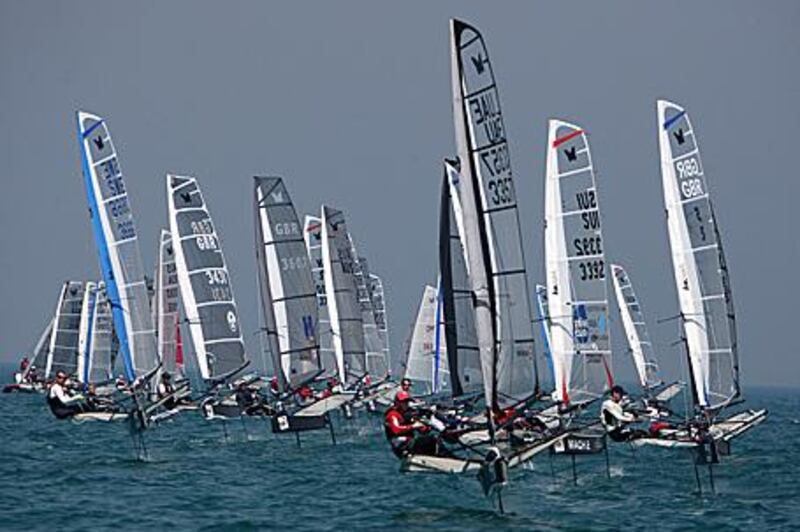 Moth racers jockey for position yesterday during the championships in Dubai.