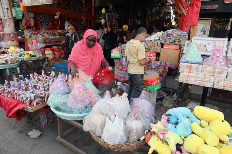 Egyptians at a market in Cairo buy sweets for the upcoming Mawlid celebrations.    EPA