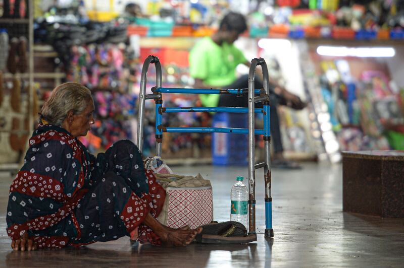 A woman is stuck at a bus terminal in Chennai after public buses were suspended because of the nationwide strike. AFP