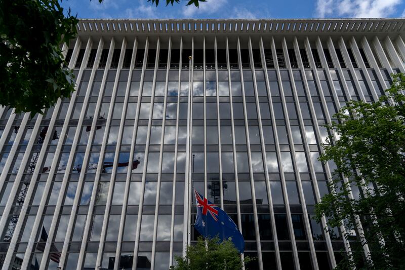 The Australian flag files at half-staff at the Australian Embassy, Thursday, September 8, 2022, in Washington, after Queen Elizabeth II, Britain's longest-reigning monarch and a rock of stability across much of a turbulent century, died Thursday after 70 years on the throne. AP