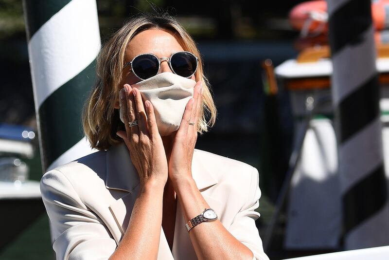 Italian actress Anna Foglietta wears a face mask as she arrives at Lido Beach ahead of the 77th annual Venice International Film Festival, on September 1, 2020. Foglietta will host the opening and closing ceremony of the festival. EPA