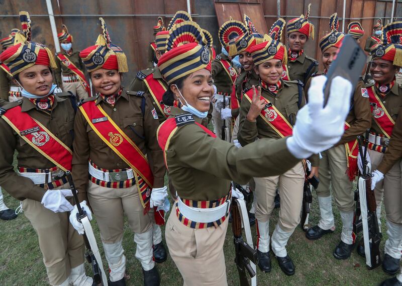 Indian Railway Protection Force officers take a selfie before taking part in a march to mark India's 73rd Republic Day celebrations in Hyderabad. AP