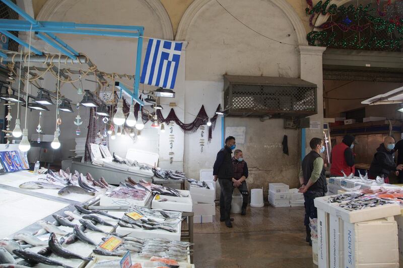 Fishmongers wait for customers during a new lockdown in Athens, Greece. Bloomberg