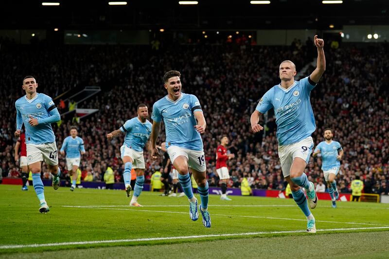 Manchester City's Erling Haaland, right, celebrates after scoring his side's opening goal. AP