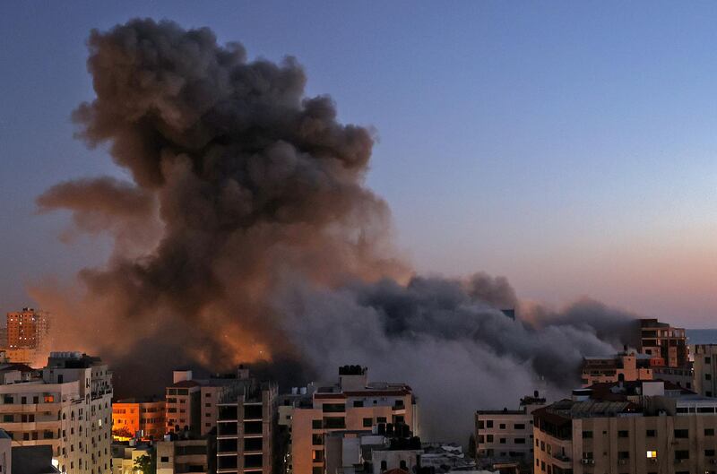 Smoke rises from buildings hit during an Israeli air strike in Gaza city. AFP