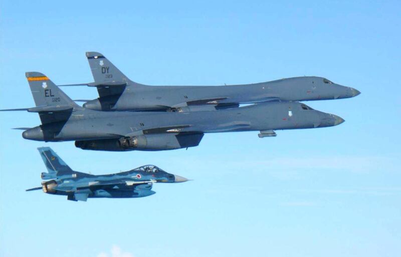 US Air Force B1-B bombers fly with a Japan Air Self Defence Force F-2 fighter during exercises over the island of Kyushu, just south of the Korean peninsula, on July 30, 2107. Japan Air Self Defence Force via AP