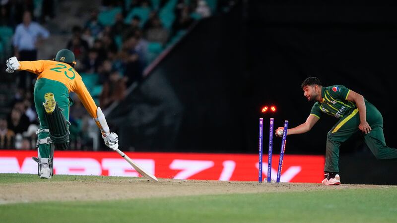 Pakistan's Haris Rauf, right, runs out South Africa's Kagiso Rabada in Sydney. AP