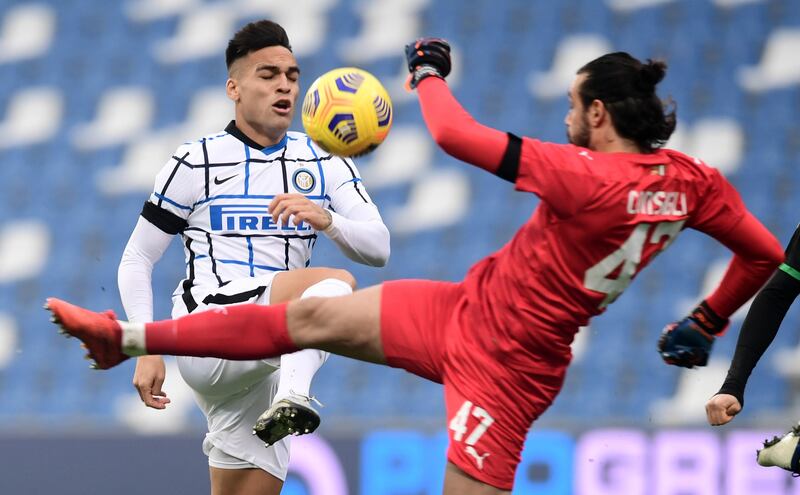 Inter Milan's Lautaro Martinez tries to finish past Sassuolo goalkeeper Andrea Consigli. Reuters