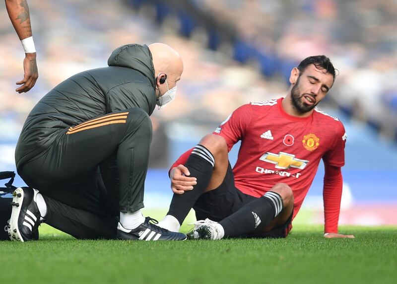 Bruno Fernandes of Manchester United receives medical assistance during the English Premier League match against Everton on November 7, 2020.  EPA