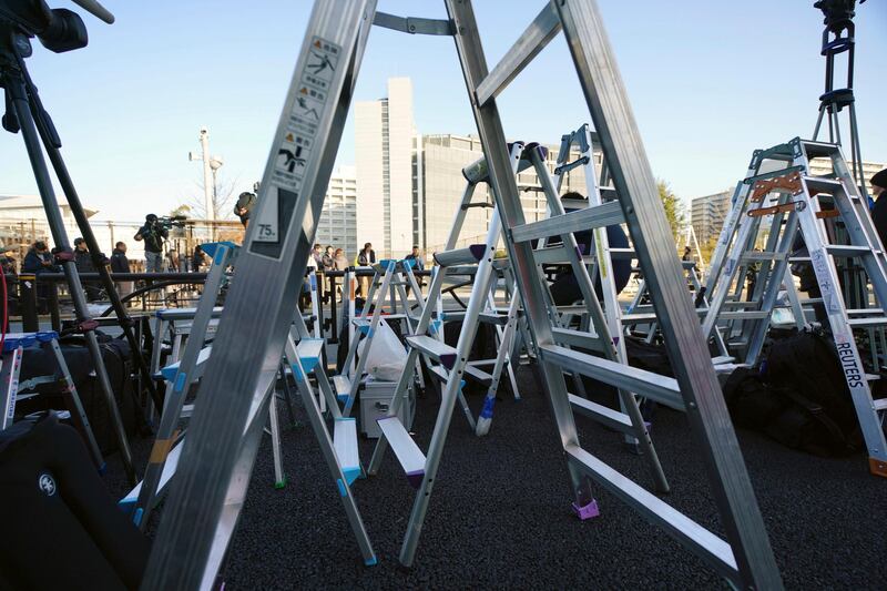 Step ladders of journalists are placed in front of Tokyo Detention Center in Tokyo, Japan. AP Photo