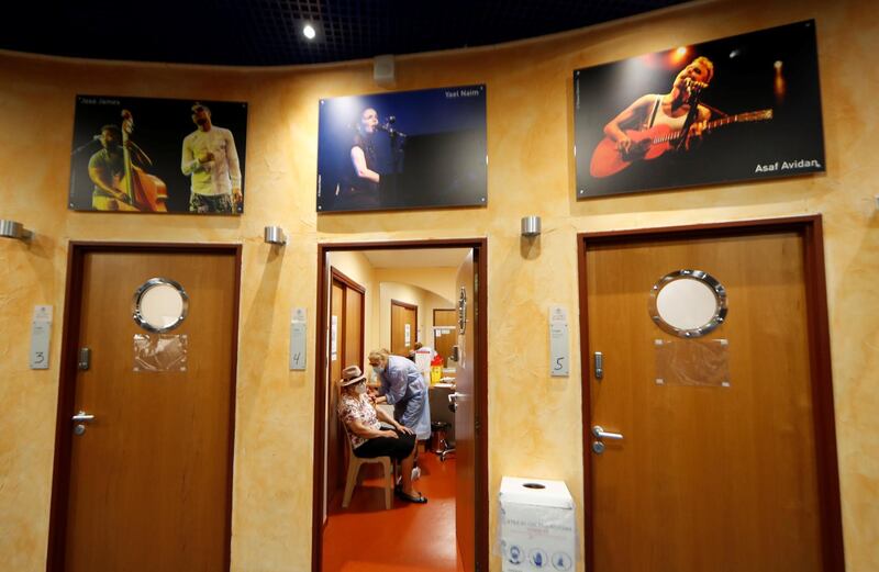 A senior citizen receives a coronavirus vaccine at the Theatre de Verdure in Nice, France, which has been transformed into a vaccination centre. Reuters