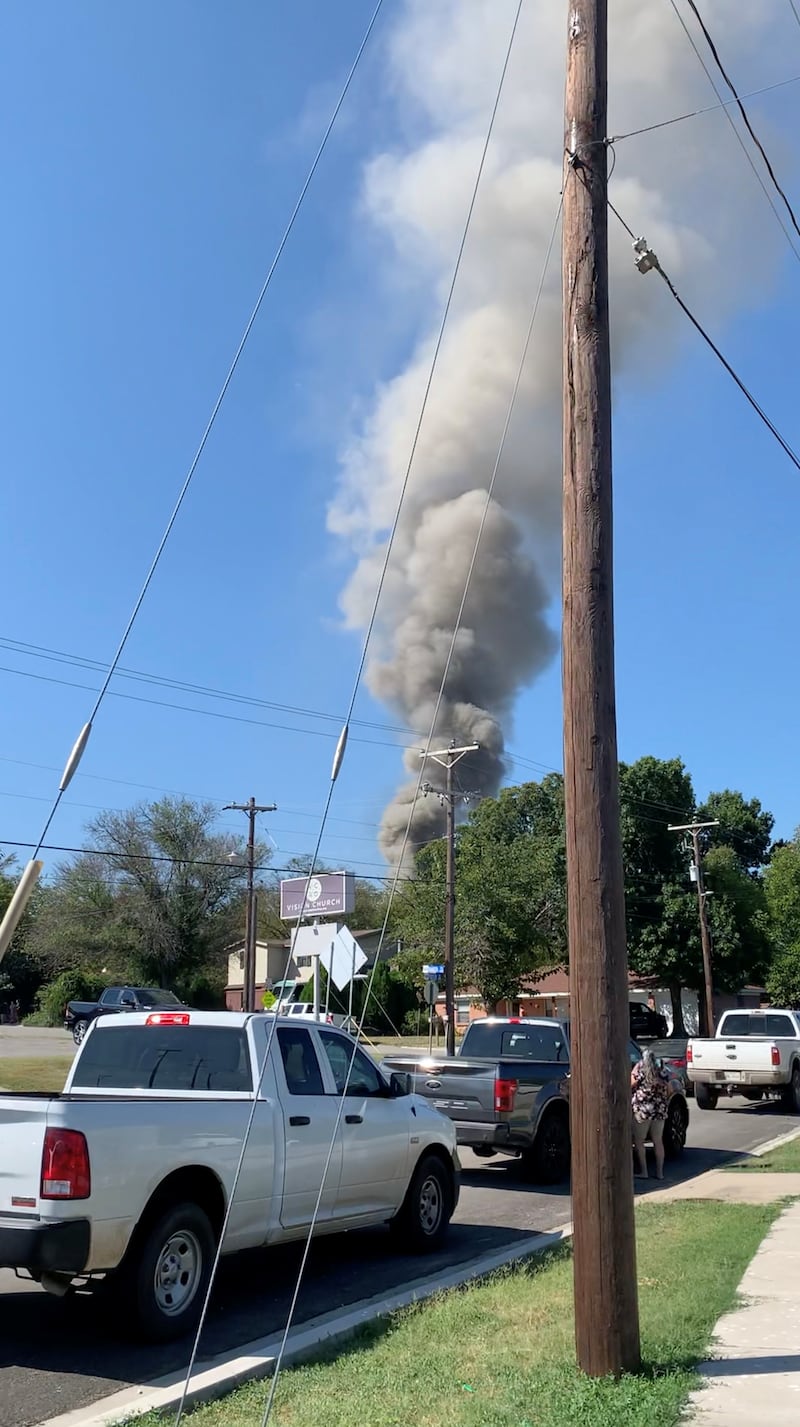 Smoke rises from the site where a military training aircraft crashed into a neighbourhood in Lake Worth, Texas, on Sunday. Jorge Moreno Jr via Reuters