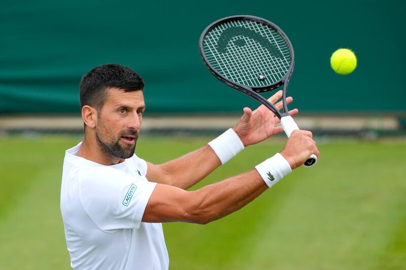 Novak Djokovic practices on Court 2 at the All England Lawn Tennis and Croquet Club in Wimbledon. AP