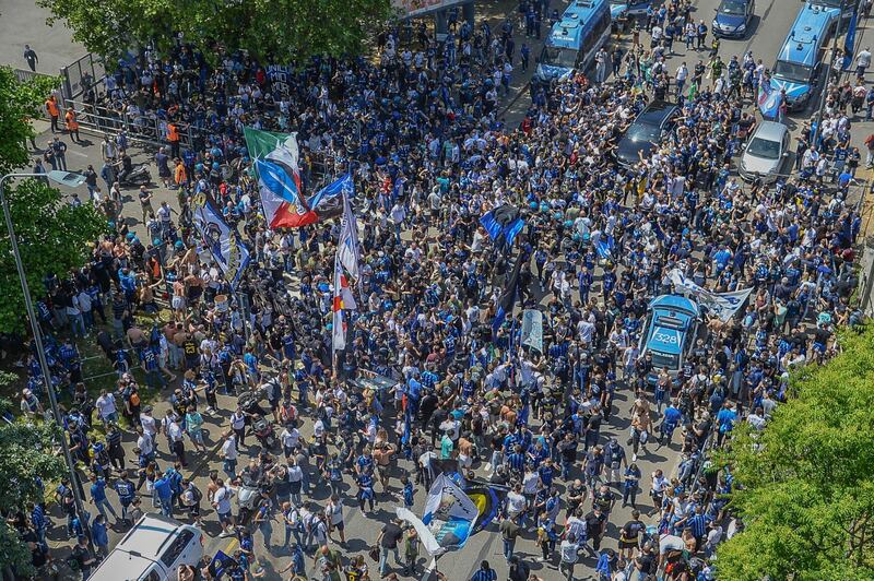 Inter supporters celebrate outside the San Siro before the match. EPA