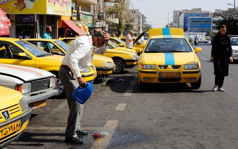 More cold water for Iran’s taxi drivers. Abedein Taherkenareh / EPA