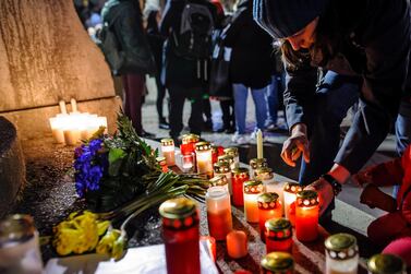 Mourners place candles and flowers at the Unity Memorial as people attend a vigil after the Hanau terror attack at the St. Paul's Church in Frankfurt am Main, Germany. EPA/MAXIMILIAN VON LACHNER
