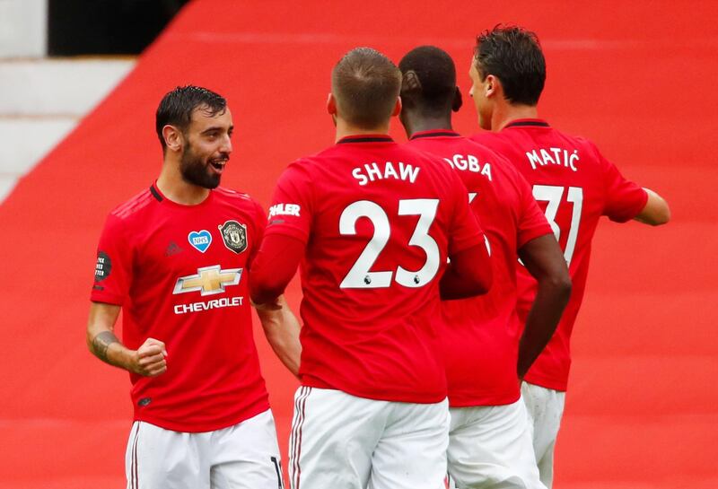 Manchester United's Bruno Fernandes celebrates with teammates after scoring a free-kick. Reuters