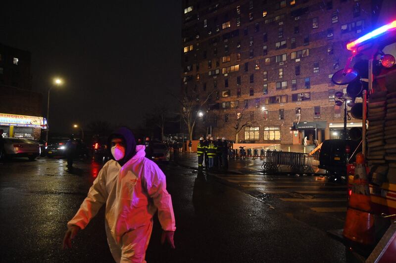 A worker at the scene in the Bronx.  AFP