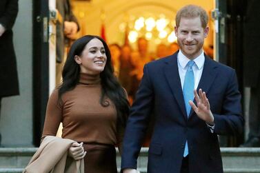 FILE - Prince Harry and Meghan, the Duke and Duchess of Sussex, leave after visiting Canada House on Jan. 7, 2020, in London. The royal couple and guests from Elton John to their son Archie appear on their new podcast's first audio release on Tuesday, Dec. 29, 2020, for Spotify, a 34-minute special with reflections on 2020. (AP Photo/Frank Augstein, File)