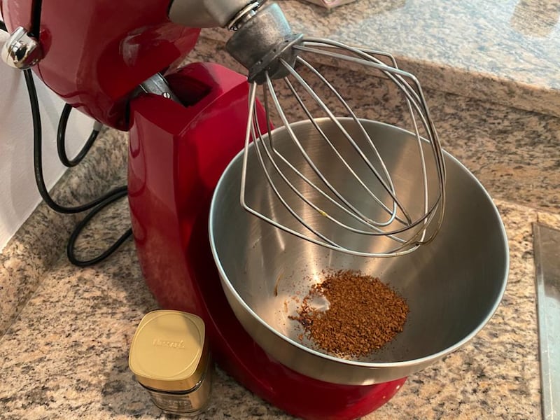 Step 1: Add equal part instant coffee, sugar and hot water to a mixing bowl.