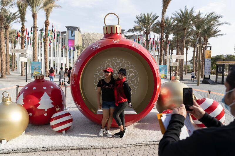 An outsized Christmas bauble provides the perfect backdrop for a festive photo at the Expo.