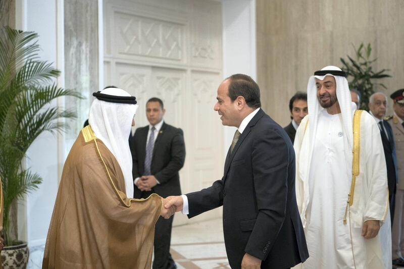 CAIRO, EGYPT - August 07, 2018: HE Abdel Fattah El Sisi, President of Egypt (C) greets HE Dr Anwar bin Mohamed Gargash, UAE Minister of State for Foreign Affairs (L), at the Heliopolis Palace. Seen with HH Sheikh Mohamed bin Zayed Al Nahyan, Crown Prince of Abu Dhabi and Deputy Supreme Commander of the UAE Armed Forces (R).
( Mohamed Al Hammadi / Crown Prince Court - Abu Dhabi )
---