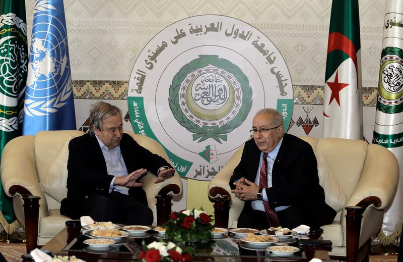 Algerian Foreign Minister Ramtane Lamamra, right, receives UN Secretary General Antonio Guterres before his appearance at the summit as a guest of honour. AP