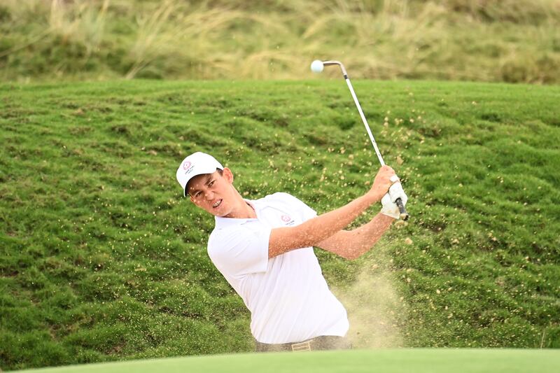 Josh Hill of England plays a bunker shot for his third shot on the seventh hole. Getty Images