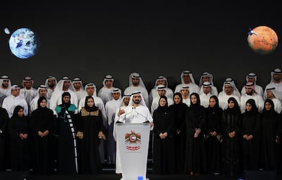 Dubai ruler Sheikh Mohammed bin Rashid Al Maktoum, center, announces a United Arab Emirates' Mars mission named "Hope" ��� or "al-Amal" in Arabic ��� which is scheduled be launched in 2020, during a ceremony in Dubai, UAE, Wednesday, May 6, 2015. It would be the Arab world's first space probe to Mars and will take seven to nine months to reach the red planet, arriving in 2021. Emirati scientists hope the unmanned probe will provide a deeper understanding of the Martian atmosphere, and expect it to remain in orbit until at least 2023. (AP Photo/Kamran Jebreili)