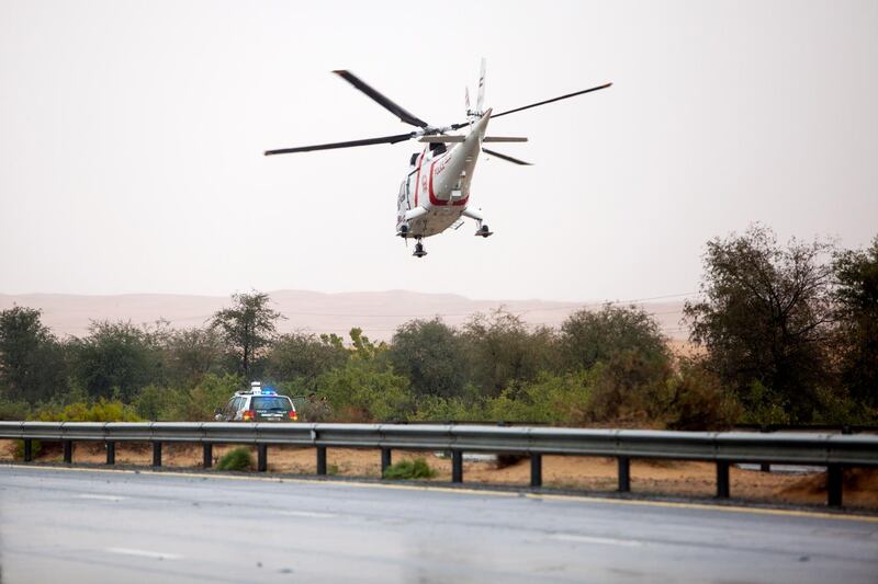 Dubai, United Arab Emirates, February 9, 2014:      Emergency crews evacuate a motorist by helicopter after a vehcile went off the road northbound along the Dubai - Al Ain road, Highway 66 near exit 65, during heavy rain on February 9, 2014. Christopher Pike / The National

Reporter: N/A
Section: News