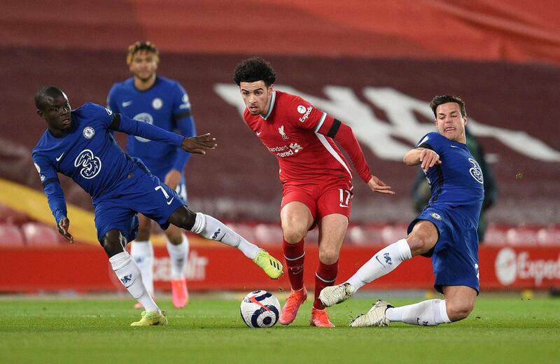 Liverpool's Curtis Jones with Chelsea's N'Golo Kante and Cesar Azpilicueta. Reuters