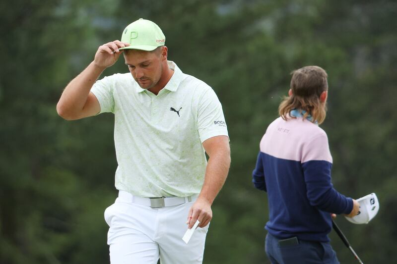 Bryson DeChambeau reacts on the 18th green after finishing his second round at The Masters at Augusta National Golf Club on April 8, 2022. The world No 22 missed the cut after shooting a 76 and an 80. Getty / AFP
