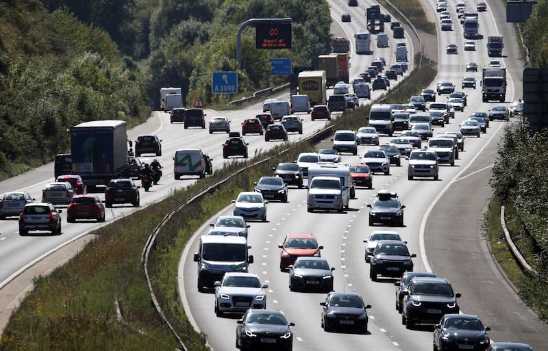 Traffic makes its way along the M3 motorway near Winchester in Hampshire. PA