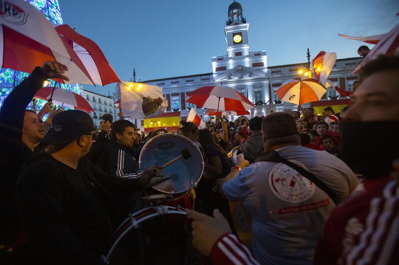 Fans of River Plate enjoy the atmosphere as they gather at Puerta del Sol Square. Getty Images