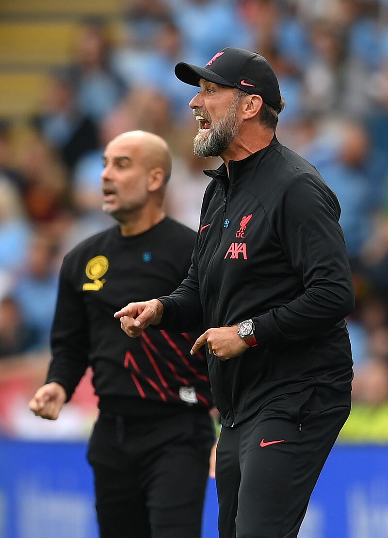 Pep Guardiola, manager of Manchester City, looks on next to Jurgen Klopp. Getty