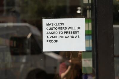 A sign outside a New York City restaurant states maskless patrons will have to show proof of vaccination, starting on May 19, 2021. Willy Lowry / The National 