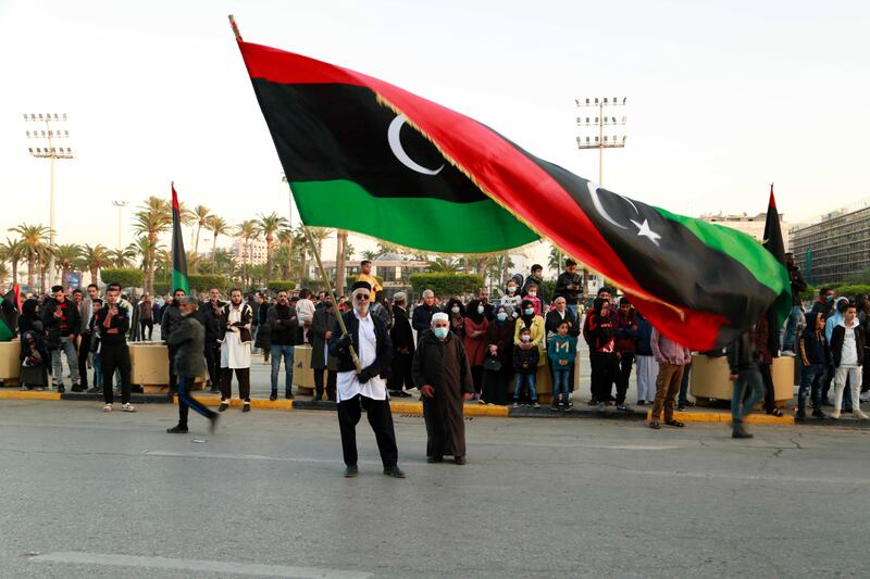 Libyans celebrate the 70th anniversary of their country's independence, despite widespread disappointment over the postponement of presidential elections, in Martyrs' Square, Tripoli, on December 24, 2021. AP