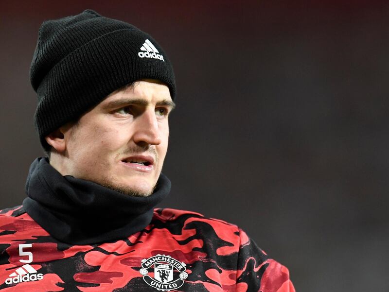 epa09036582 Manchester United's Harry Maguire warms up for the UEFA Europa League round of 32, second leg soccer match between Manchester United and Real Sociedad in Manchester, Britain, 25 February 2021.  EPA/PETER POWELL