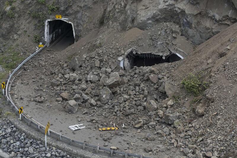 Landslides block a tunnel on State Highway One. David Alexander / SNPA via AP